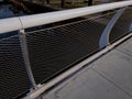 stainless steel mesh stretched on bridge railing.lower steel rope serves Royalty Free Stock Photo