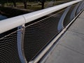 stainless steel mesh stretched on bridge railing.lower steel rope serves Royalty Free Stock Photo