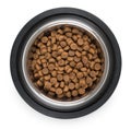 Stainless steel metal bowl for dog, cat or other pet with dried food isolated on a white background, top view Royalty Free Stock Photo