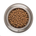 Stainless steel metal bowl for dog, cat or other pet with dried food isolated on a white background, top view Royalty Free Stock Photo