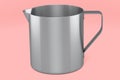 Stainless steel milk frothing pitcher cup with handle on pink background. Royalty Free Stock Photo