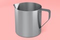 Stainless steel milk frothing pitcher cup with handle on pink background. Royalty Free Stock Photo