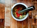 Stainless steel mortar and pestle, efficiently peel and mash garlic and chili Royalty Free Stock Photo