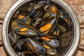 Stainless steel pan filled with steamed mussels Royalty Free Stock Photo