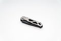 Stainless steel pocketknife with a black blade isolated on a white background