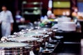 Stainless steel pot on the buffet table with selective focus