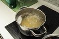 Stainless steel pot filled with boiling water Royalty Free Stock Photo