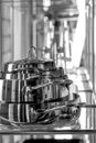 Stainless steel pots on glass shelf Royalty Free Stock Photo