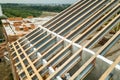 Stainless steel roof structure for future roof under construction. Development of metal roofing frame on house top Royalty Free Stock Photo