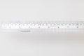 Stainless steel ruler with inches and centimeters Royalty Free Stock Photo