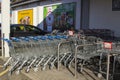 Stainless steel shopping trolleys outside a Lidl`s supermarket