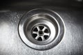 Stainless steel sink plug hole Royalty Free Stock Photo