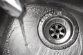 Stainless steel sink plug hole Royalty Free Stock Photo