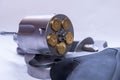 A stainless steel, snub nose 454 casull revolver, with the cylinder opened showing that it`s loaded