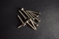 Stainless steel Star Screws on Black Background Royalty Free Stock Photo