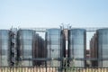 Stainless steel storage tanks or vats for wine fermentation and maturation in modern winery factory production Royalty Free Stock Photo