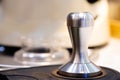 stainless steel tamper.barista equipment.heavy tamper for professional barista brew espresso coffee.close up tamper in coffee shop Royalty Free Stock Photo