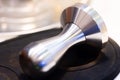 stainless steel tamper.barista equipment.heavy tamper for professional barista brew espresso coffee.close up tamper in coffee shop Royalty Free Stock Photo