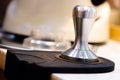 stainless steel tamper.barista equipment.heavy tamper for professional barista brew espresso coffee.close up tamper in coffee shop Royalty Free Stock Photo
