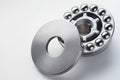 Stainless steel thrust ball bearing. Set of thrust ball bearing and shiny silver ball bearing. Spare parts for roller machine in Royalty Free Stock Photo