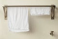 Stainless steel towel hanger on white cement wal Royalty Free Stock Photo