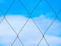 stainless steel twisted wire cable fence detail. diamond pattern net or mesh Royalty Free Stock Photo