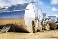 Stainless steel wine vats in a row outside the winery Royalty Free Stock Photo