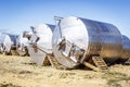 Stainless steel wine vats in a row outside the winery Royalty Free Stock Photo