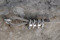 Stainless twisted rope anchored in rocky wall