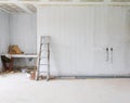 Stair aluminum leaning wall in building construction site with gypsum board ceiling structure and plaster mortar Royalty Free Stock Photo