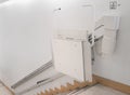 Stairlift on staircase for elderly people in a building Royalty Free Stock Photo