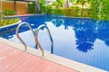 Stair swimming pool in beautiful luxury hotel pool resort Royalty Free Stock Photo