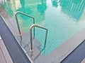 Stair in swimming pool with reflexing on water