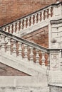 Staircase with a balustrade in old house, Rome, Italy Royalty Free Stock Photo