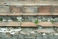 A staircase with broken boards and weeds Royalty Free Stock Photo