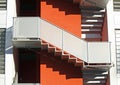 Staircase of a building orange and the shadows of the steps Royalty Free Stock Photo