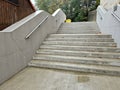 a staircase with concrete sides at a public building. the Royalty Free Stock Photo