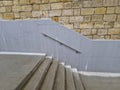 a staircase with concrete sides at a public building. the Royalty Free Stock Photo