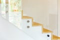 Staircase covered in oak parquet with tempered glass balustrade and chromed pins Royalty Free Stock Photo