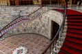 Staircase covered with red carpet in lobby Royalty Free Stock Photo