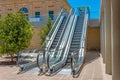 Staircase escalator bottom view on the outside street in the courtyard of the building Royalty Free Stock Photo