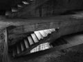 Staircase between floors in an empty messy industrial warehouse, urban exploration of the interior of an abandoned building, Royalty Free Stock Photo