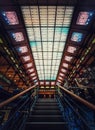 Staircase inside the Museum of Natural History, Paris, France. Architectural details and glowing glass ceiling