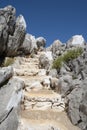 Staircase Leading to a Path to Pedi Harbor from St. Nicholas Beach on Symi Greece Royalty Free Stock Photo