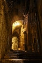 The staircase and the mysterious vault. Dark nightly narrow streets of the old city,