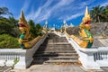 Staircase with Naga snakes to Wat Kaew Korawaram white temple in Krabi Town in Thailand