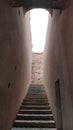 staircase in the narrow corridor of the ruined palace