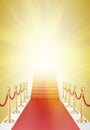 Staircase and red carpet between two gold stanchions with rope Royalty Free Stock Photo