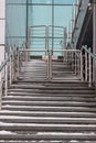 A staircase rising in a modern office building with metal rails on the sides Royalty Free Stock Photo