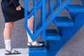 staircase. Schoolgirl climbs the stairs.